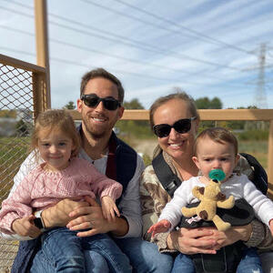 Erin Abbott with family at an outdoor sporting event